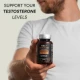 Man holding a bottle of FabÜ Shrooms Andropause, stating Support Your Testosterone levels