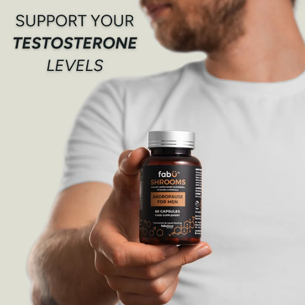 Man holding a bottle of FabÜ Shrooms Andropause, stating Support Your Testosterone levels